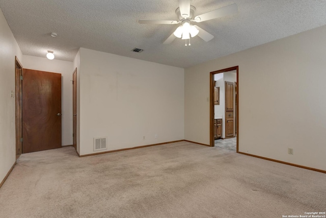 14215 Indian Woods, San Antonio, TX 78249 - empty room with light colored carpet, baseboards, a ceiling fan, and visible vents