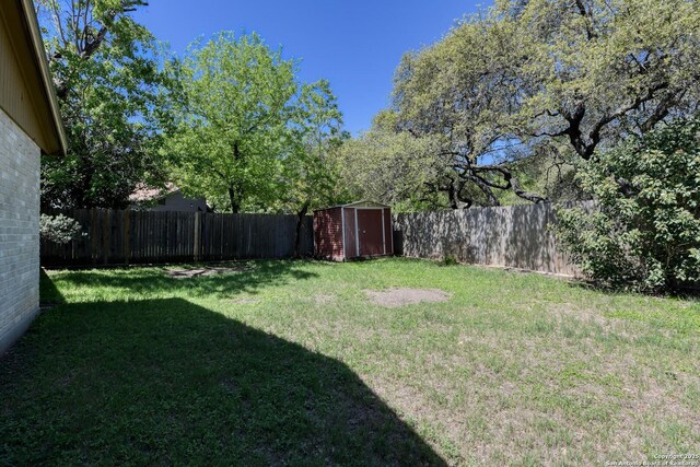 14215 Indian Woods, San Antonio, TX 78249 - view of yard featuring a shed, a fenced backyard, and an outdoor structure