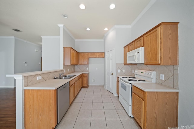 kitchen with white appliances, visible vents, crown molding, a sink, and light tile patterned flooring