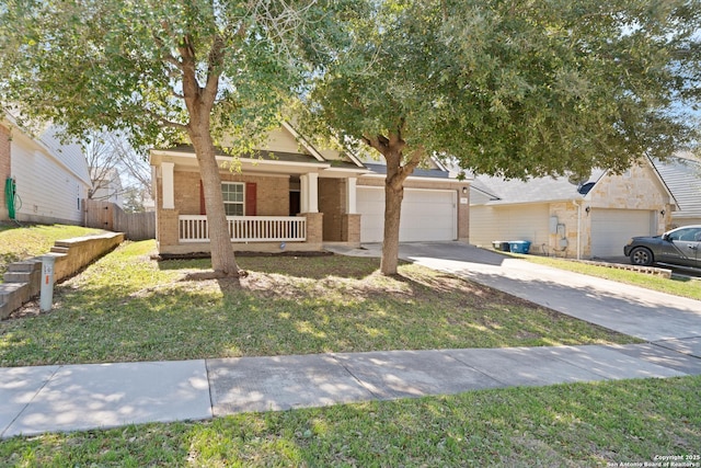 view of front of property with driveway, a porch, a front lawn, and brick siding