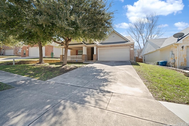 view of front of home featuring brick siding, covered porch, concrete driveway, a front yard, and a garage