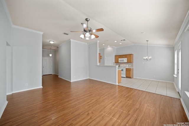 unfurnished living room featuring light wood-style flooring, visible vents, crown molding, and ceiling fan with notable chandelier