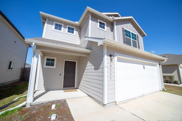 view of front facade with a garage and board and batten siding