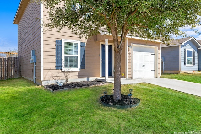 view of front of home with a front yard, concrete driveway, fence, and an attached garage