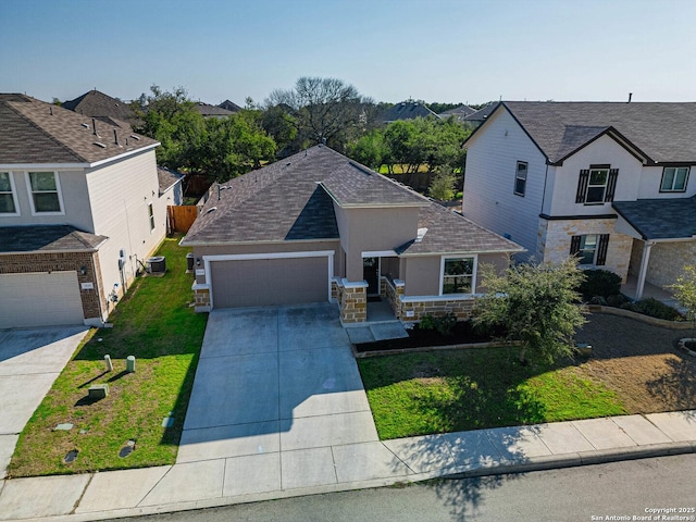 view of front of property featuring concrete driveway, stone siding, a residential view, cooling unit, and a front lawn