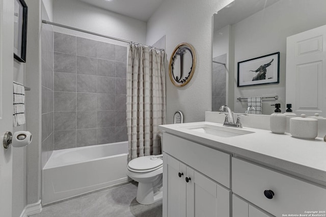 bathroom with a textured wall, vanity, shower / bath combination with curtain, and toilet