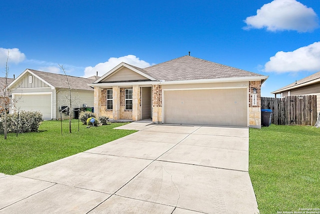 ranch-style house featuring a front yard, driveway, an attached garage, and fence