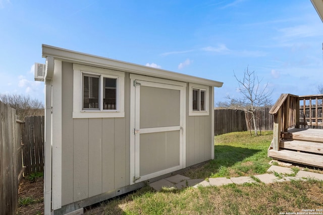 view of shed with a fenced backyard