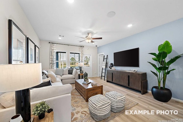 living room featuring recessed lighting, visible vents, light wood-style flooring, ceiling fan, and baseboards