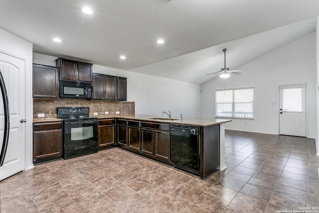 kitchen featuring tasteful backsplash, dark brown cabinets, lofted ceiling, black appliances, and a sink