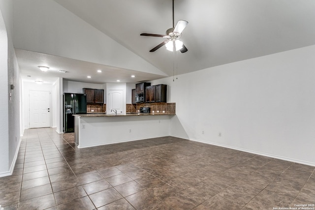 kitchen with dark brown cabinetry, black appliances, open floor plan, and a ceiling fan