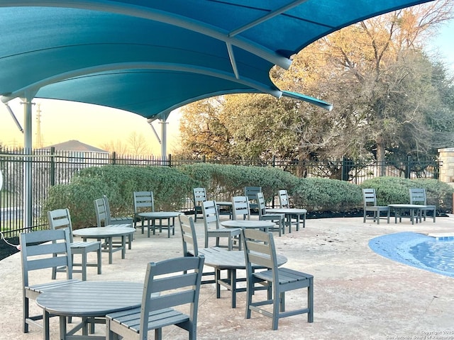 view of home's community with a patio and fence