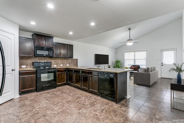 kitchen featuring a sink, black appliances, vaulted ceiling, dark brown cabinets, and open floor plan