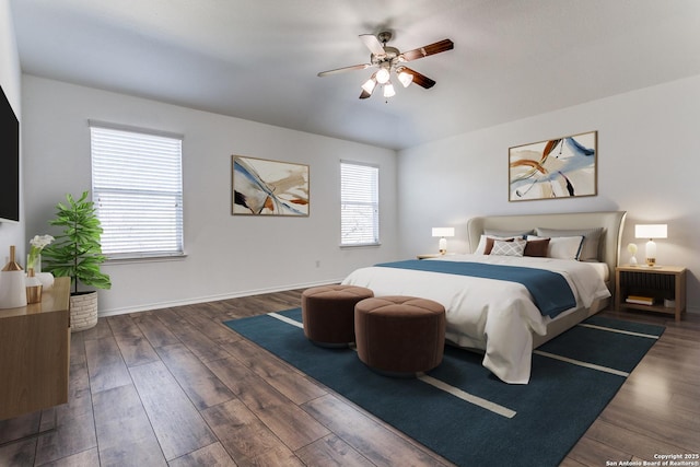 bedroom with ceiling fan, baseboards, and wood finished floors