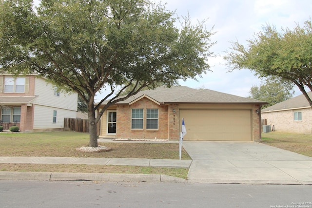 view of front facade featuring brick siding, an attached garage, central AC, driveway, and a front lawn