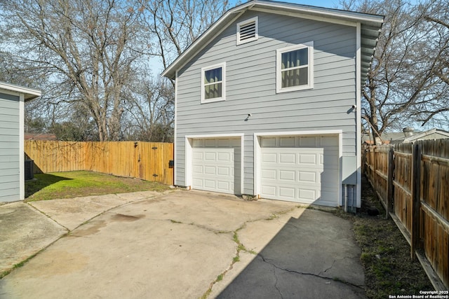 garage featuring fence