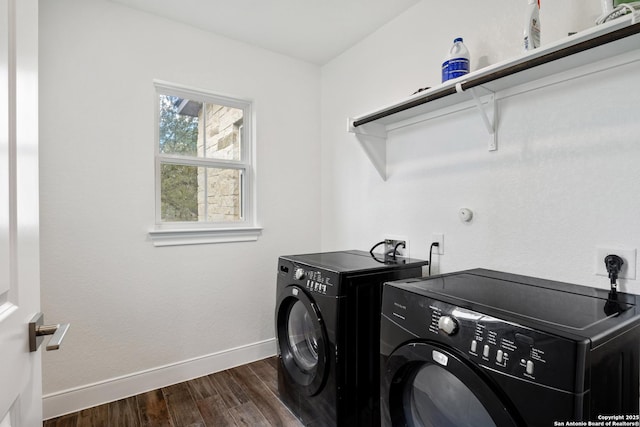 laundry room featuring laundry area, washing machine and dryer, dark wood finished floors, and baseboards