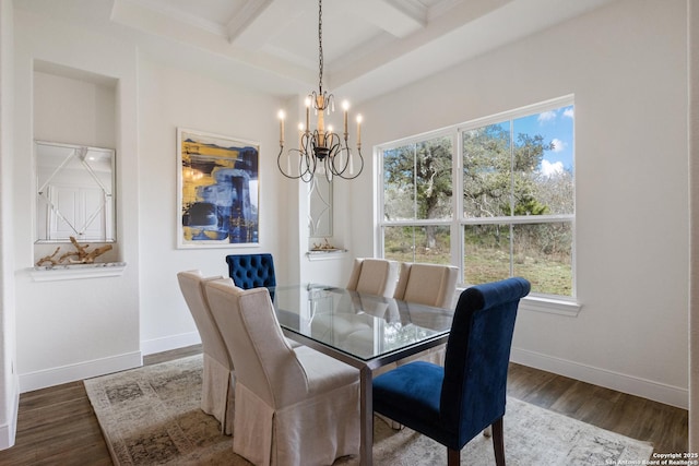 dining room featuring baseboards, an inviting chandelier, and wood finished floors