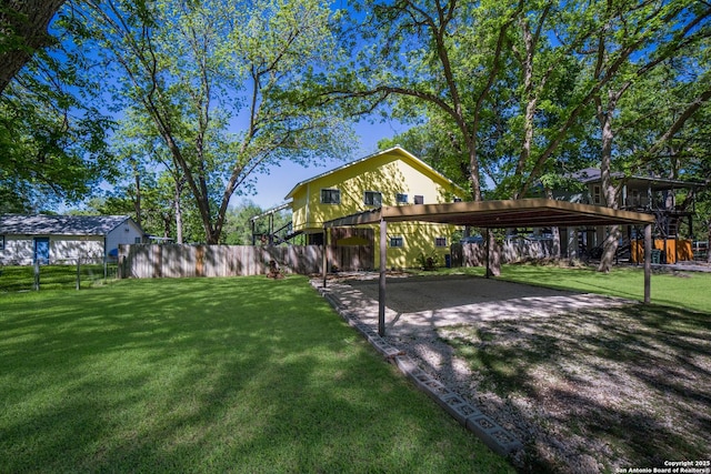 exterior space featuring a front yard and fence