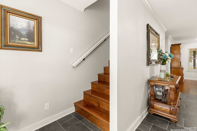 stairs with tile patterned flooring, crown molding, and baseboards