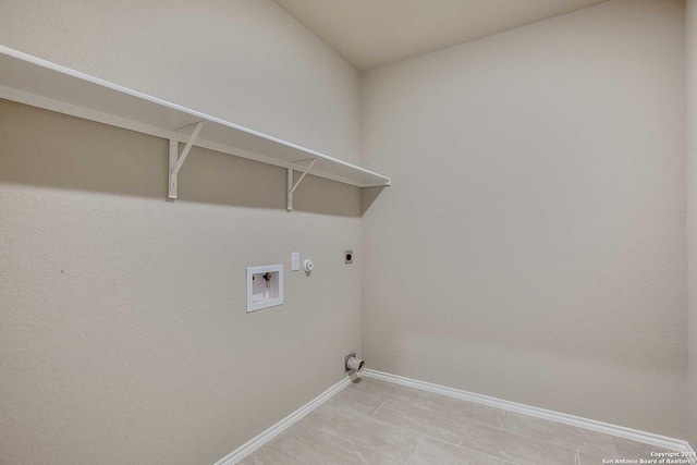 laundry room with washer hookup, hookup for an electric dryer, gas dryer hookup, laundry area, and baseboards