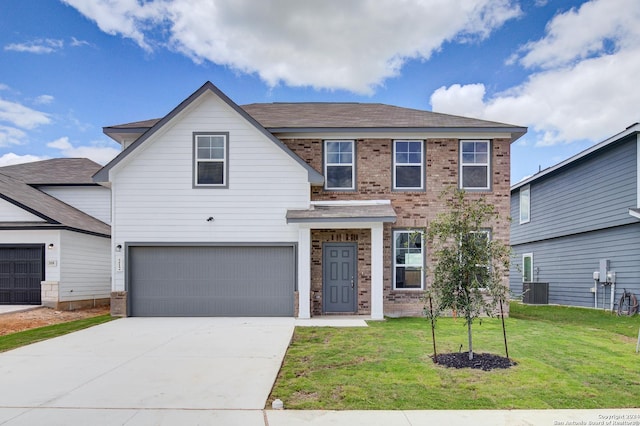 view of front of property with brick siding, an attached garage, central AC unit, a front yard, and driveway