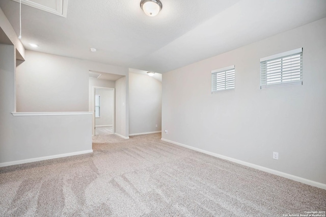 below grade area with carpet and baseboards