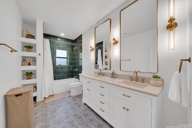 full bath with toilet, double vanity, a sink, and shower / bath combo with shower curtain