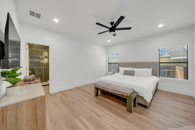 bedroom featuring recessed lighting, visible vents, light wood finished floors, and multiple windows