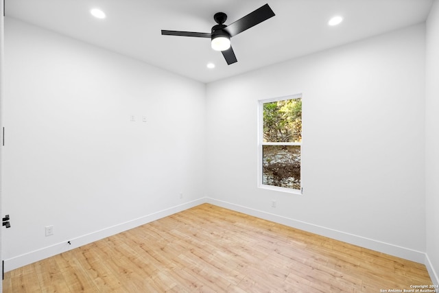 unfurnished room featuring ceiling fan, recessed lighting, wood finished floors, and baseboards