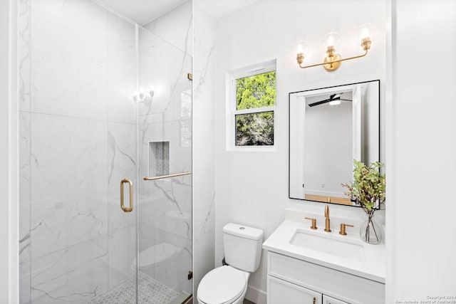 full bathroom with vanity, a marble finish shower, and toilet