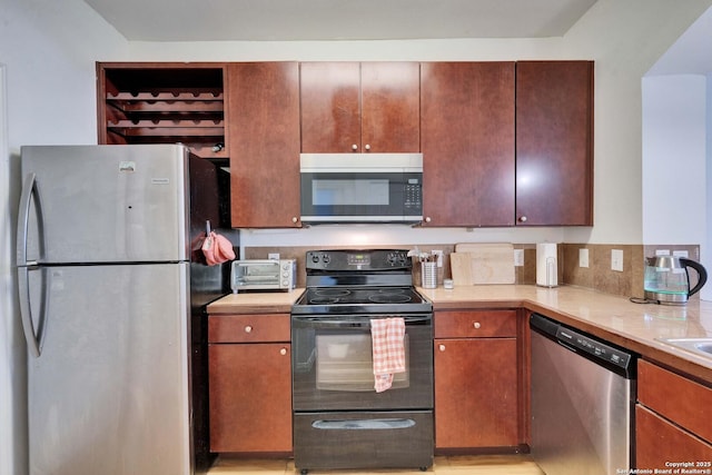 kitchen featuring light countertops and appliances with stainless steel finishes