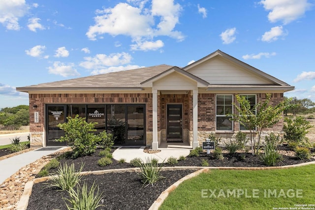 view of front of property featuring brick siding