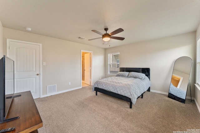 bedroom with ceiling fan, carpet floors, visible vents, and baseboards