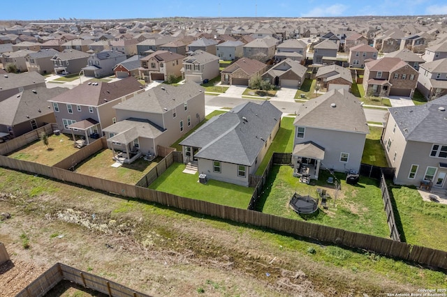 birds eye view of property with a residential view