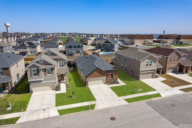 birds eye view of property with a residential view