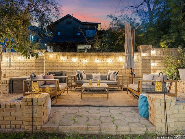 view of patio / terrace featuring area for grilling, fence, and an outdoor hangout area