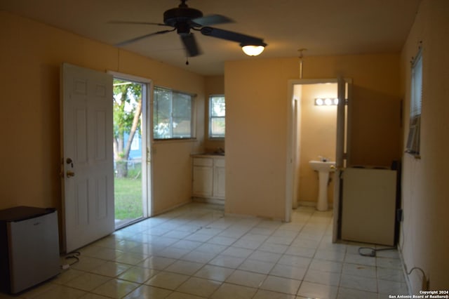 entrance foyer featuring a ceiling fan and light tile patterned floors