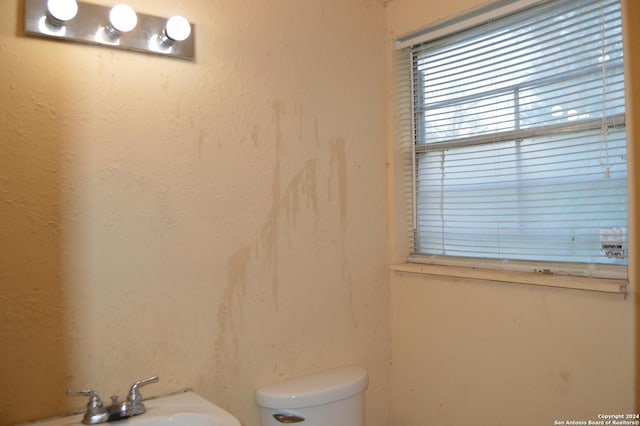 bathroom featuring toilet and a sink