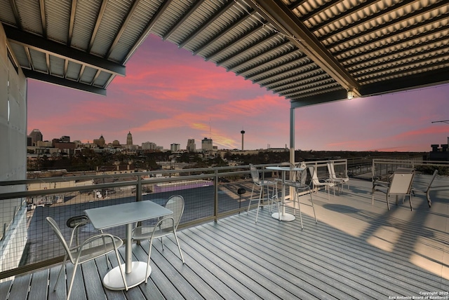 wooden terrace with a city view