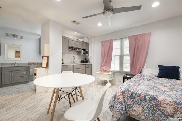 bedroom featuring marble finish floor, visible vents, a sink, and recessed lighting