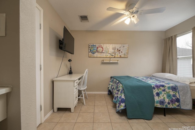 bedroom with light tile patterned floors, baseboards, visible vents, and ceiling fan