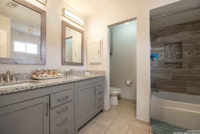 full bath with toilet, tile patterned flooring, visible vents, and a sink