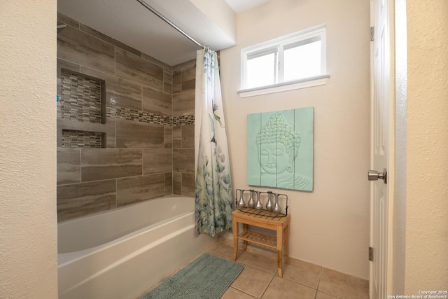 full bathroom with shower / bath combo and tile patterned floors