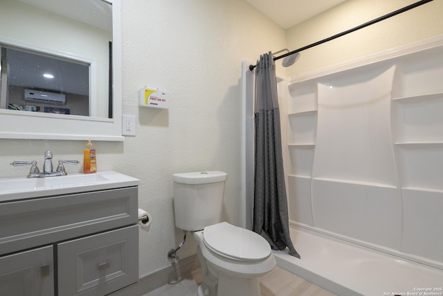 full bath with a stall shower, vanity, toilet, and wood finished floors