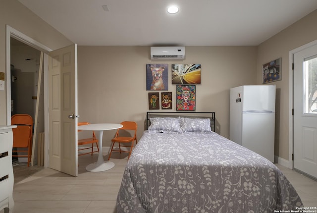 bedroom with recessed lighting, a wall unit AC, freestanding refrigerator, and baseboards