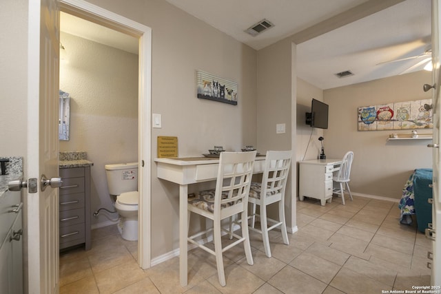 dining area with light tile patterned flooring, visible vents, and a ceiling fan