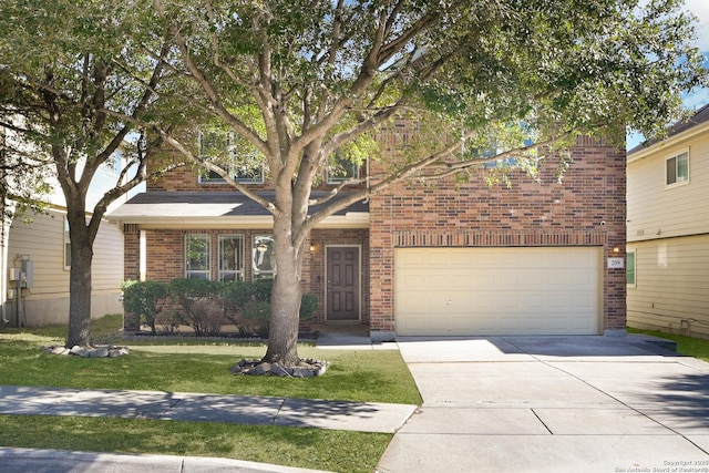 view of front of home with concrete driveway, brick siding, and a front lawn