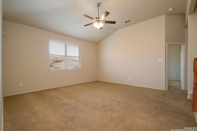 unfurnished room with lofted ceiling, light carpet, visible vents, and a ceiling fan