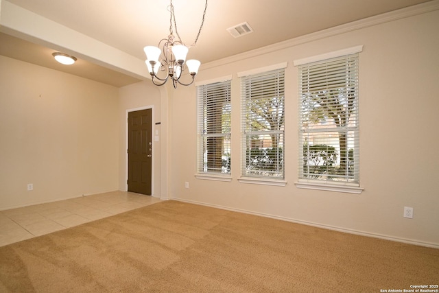 carpeted empty room featuring tile patterned floors, visible vents, baseboards, and an inviting chandelier